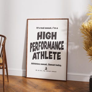 May include: A black and white motivational poster with the text "It's real sweat. I'm a HIGH PERFORMANCE ATHLETE. Athletes sweat. Sweat baby. Ki ki ki, ra, sweat sweat."