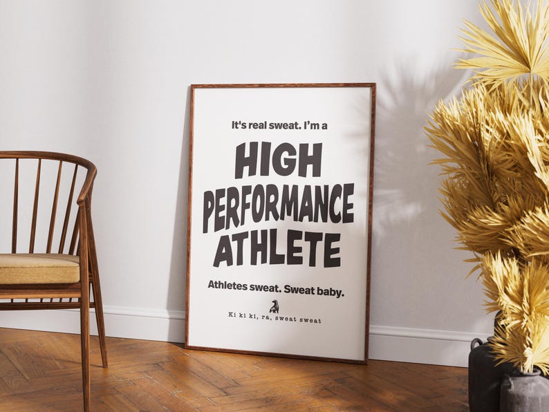 May include: A black and white motivational poster with the text "It's real sweat. I'm a HIGH PERFORMANCE ATHLETE. Athletes sweat. Sweat baby. Ki ki ki, ra, sweat sweat."