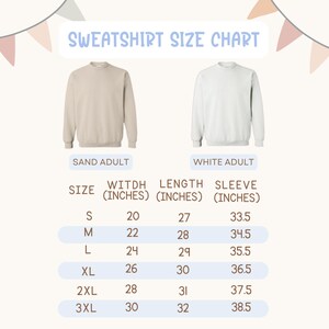 May include: Sweatshirt size chart with measurements in inches. Includes a sand-colored and white adult sweatshirt. Sizes range from S to 3XL, with width from 20 to 30 inches, length from 27 to 32 inches, and sleeve length from 33.5 to 38.5 inches.