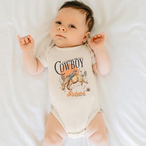 Personalized Cowboy Birthday Shirt – For Your Little Sheriff’s Big Day! 🎉

Yeehaw! Celebrate your little cowboy’s special day with this adorable personalized shirt. Perfect for wild west parties and unforgettable photos. 💛

Make their birthday special—grab yours now and let the adventure begin! 🐴✨ Cowboy Toddler Shirt! It's perfect for capturing memories together!