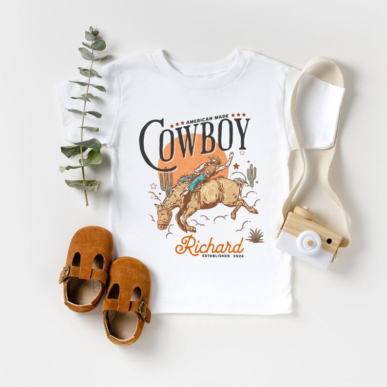 Personalized Cowboy Birthday Shirt – For Your Little Sheriff’s Big Day! 🎉

Yeehaw! Celebrate your little cowboy’s special day with this adorable personalized shirt. Perfect for wild west parties and unforgettable photos. 💛

Make their birthday special—grab yours now and let the adventure begin! 🐴✨ Cowboy Toddler Shirt! It's perfect for capturing memories together!