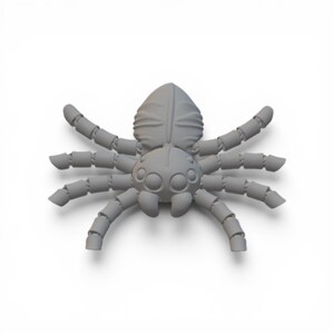 May include: A gray, 3D-printed spider figurine with segmented legs and a rounded body. The spider has multiple eyes and is set against a white background. The figurine is a detailed representation of an arachnid.