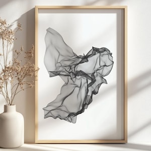May include: A black and white abstract art print of a swirling, flowing shape. The print is framed in a light wood frame.