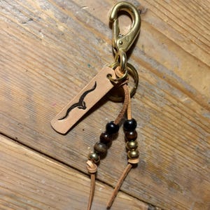 Handmade brass key chain. Laced snap clip/Japanese fish hook with brass and trade beads