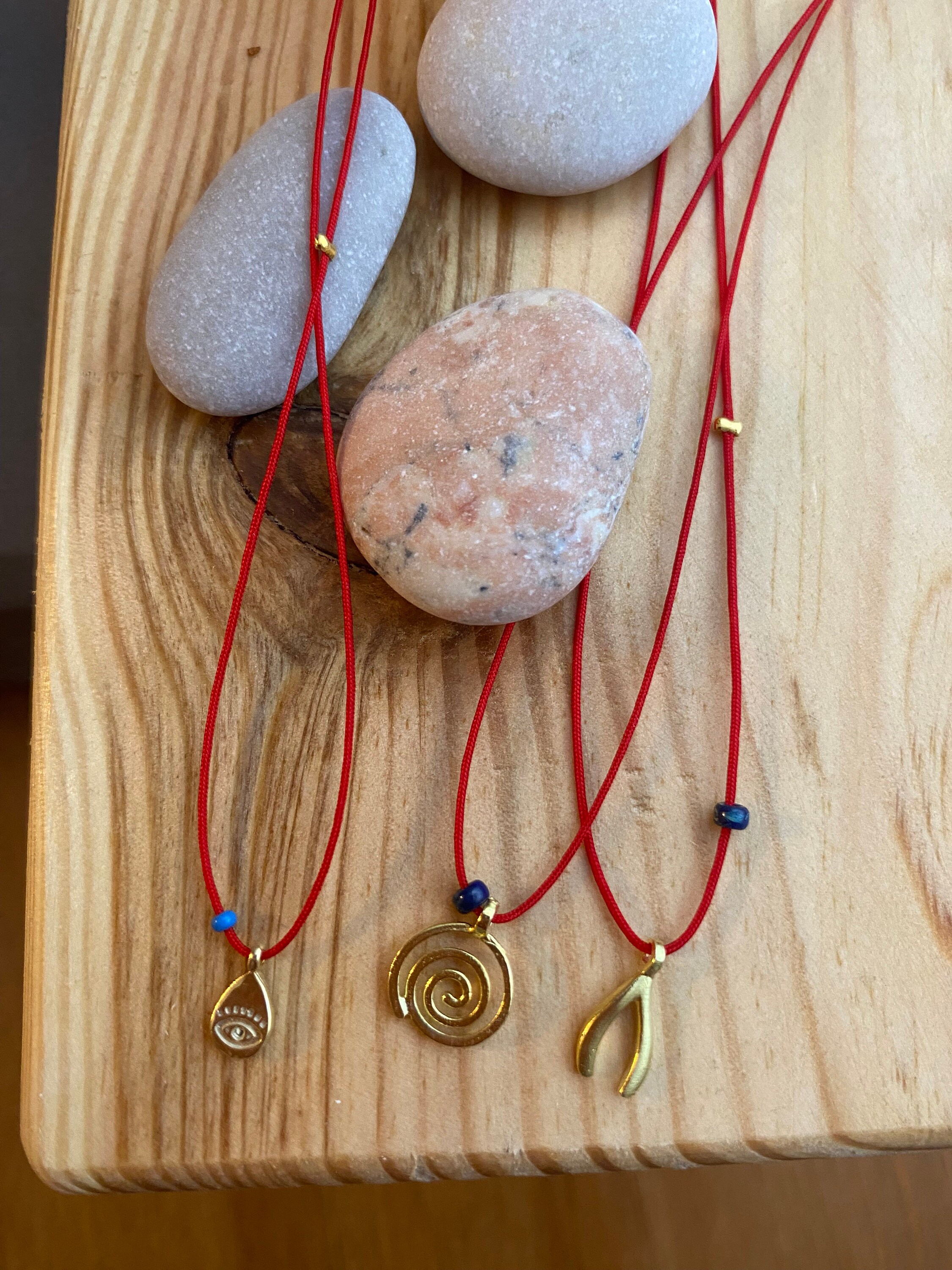 Red thread hotsell necklace