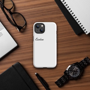 May include: White iPhone case with a black "Evolve" inscription.