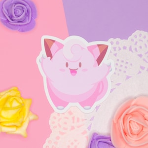 A kawaii sticker displayed on a pink and purple background.