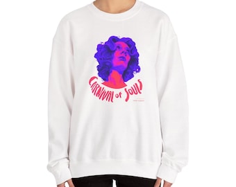 May include: White sweatshirt featuring a graphic of a woman's face with purple and red tones, and the text "CARNIVAL of SOULS" in red. The sweatshirt is a crew neck style.