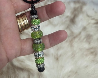 Green & black beaded black enamel keychain