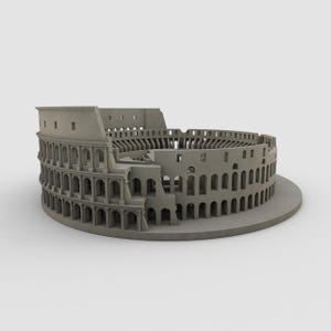 May include: A gray miniature replica of the Colosseum, an ancient Roman amphitheater. The model features detailed architectural elements, including arches, columns, and tiered seating, and is set on a circular base.