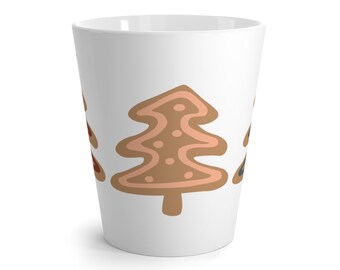 May include: A white conical mug featuring a repeating pattern of stylized gingerbread trees. The central tree is light brown with pink icing details, while the partially visible trees on the sides feature dark brown and dark blue icing accents.