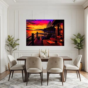 May include: A rectangular wall art print depicting a vibrant sunset over a lake, viewed from a wooden deck with a chair, a table, and a lantern. The sky is filled with intense orange, yellow, and purple hues, reflecting on the calm water surface.