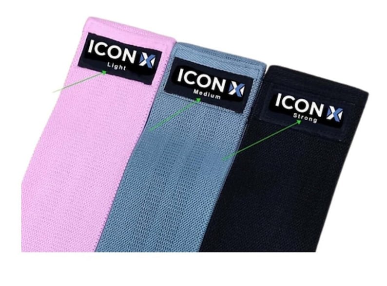 May include: Three resistance bands in pink, gray, and black. The bands are labeled "ICONX" with the words "Light", "Medium", and "Strong" printed on each band.
