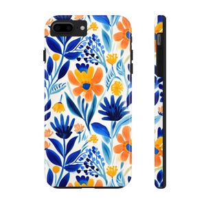 May include: A phone case with a floral pattern. The flowers are blue, orange, and yellow on a white background.