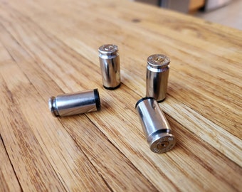 40 Caliber Valve Stem Caps - Made from once fired 40 s&w cases - Perfect for your car, truck, bicycle or atv. Nickle Plated