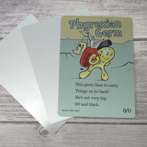 May include: A trading card featuring a cartoon Phyrexian Germ character with a red backpack and a black tube. The card has the text "Phyrexian Germ" and a poem. The card is on a light green background with three silver cards.