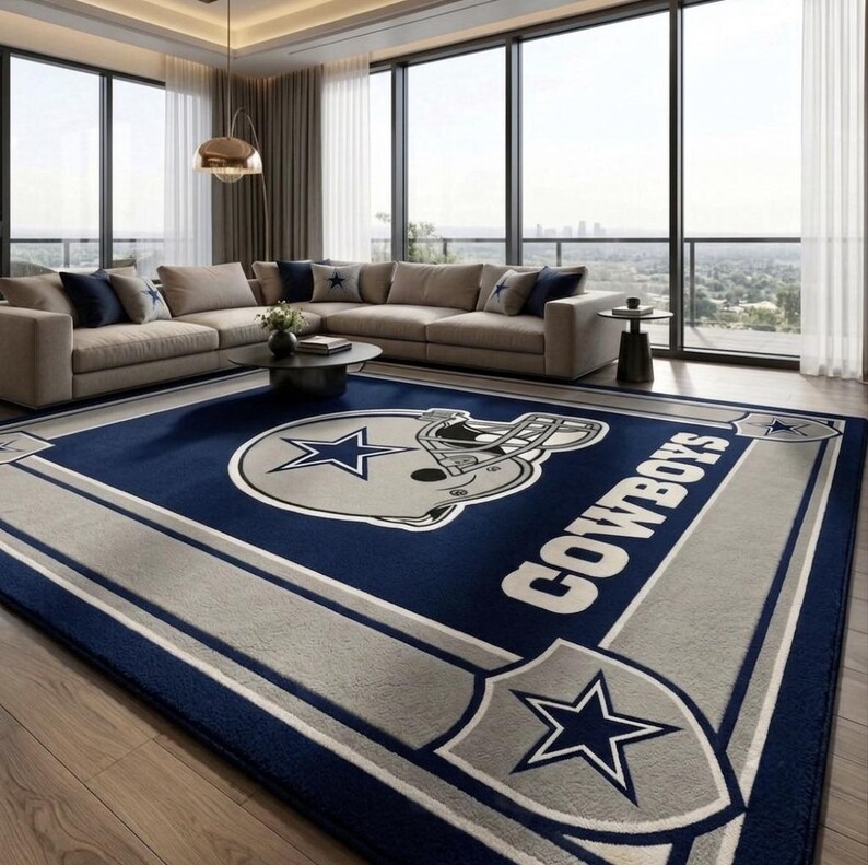 Hand tufted wool Dallas Cowboys inspired football area rug in navy blue and silver, featuring a helmet graphic, displayed in a modern luxury living room.