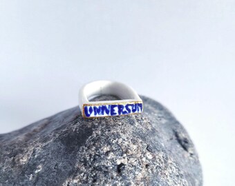 UNIVERSUM, porcelain ring bar, 22k gold, white/dark blue