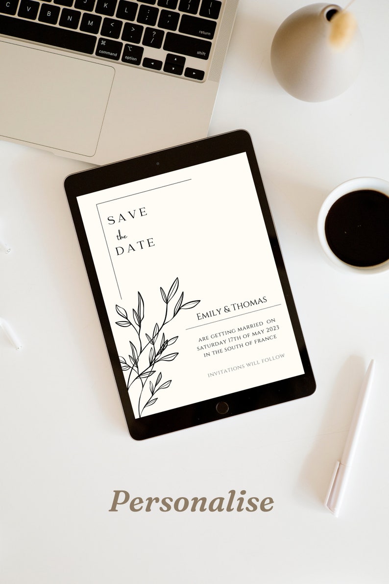 May include: A white digital tablet with a black border displays a save the date announcement for Emily & Thomas. The announcement features a simple black and white floral design and the text "Save the Date" and "Emily & Thomas are getting married on Saturday 17th of May 2023 in the South of France. Invitations will follow."