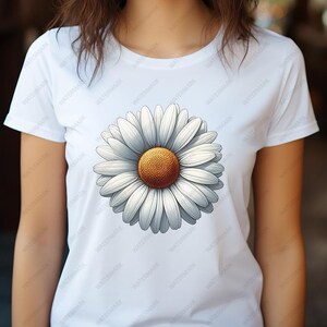 Op de afbeelding: Wit T-shirt met een grote, witte madeliefjesprint. De madeliefjes hebben een gele kern en witte bloemblaadjes.