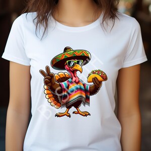 May include: White t-shirt featuring a cartoon turkey wearing a sombrero and sunglasses, with a colorful poncho and holding a taco. The turkey is making a peace sign with its left hand. The design is vibrant and playful.