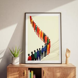 May include: A framed print of a colorful line of people standing in a queue. The people are all different colors and shapes, and they are all facing the same direction. The background is a light yellow color.