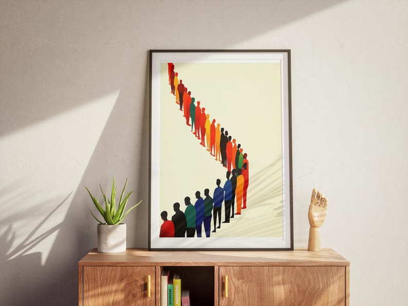 May include: A framed print of a colorful line of people standing in a queue. The people are all different colors and shapes, and they are all facing the same direction. The background is a light yellow color.