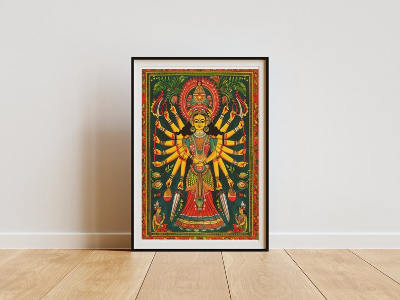 May include: A colorful painting of a Hindu goddess with multiple arms, wearing a red and yellow dress and a crown. The goddess is surrounded by flowers and other decorative elements.