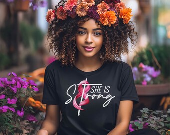 Camiseta con lazo de concientización sobre el cáncer de mama "Ella es fuerte"