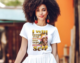 May include: White t-shirt with a gold graphic of a woman with a pink hat and the text "I will never stop being my true authentic Self".