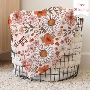 a basket that has a flower design on it