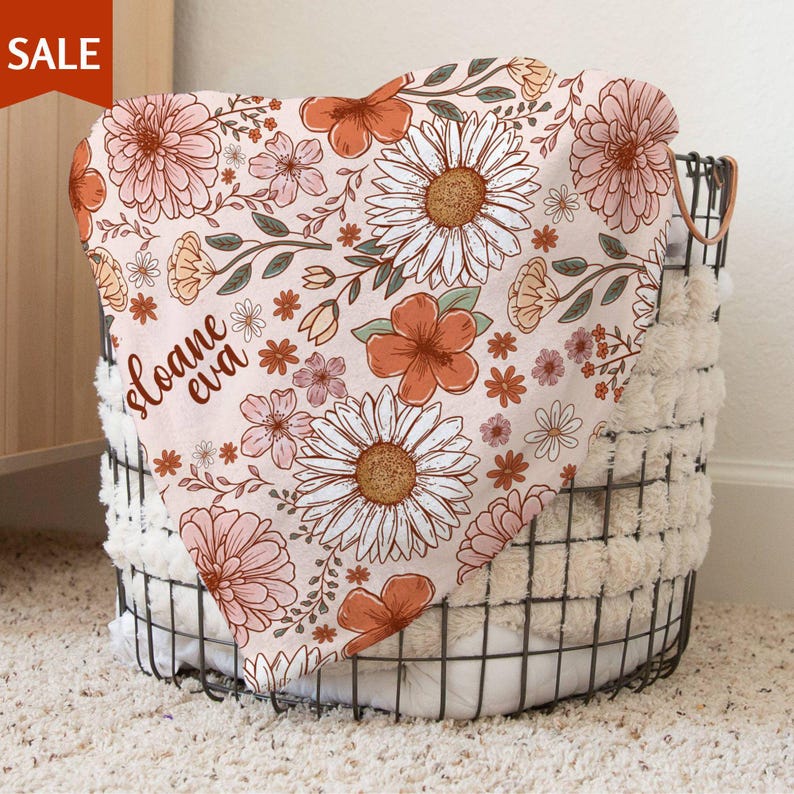 a basket that has a flower design on it
