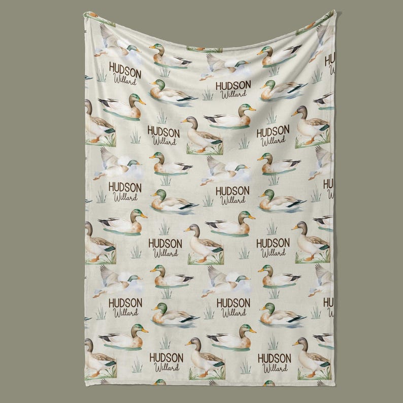 a beige fabric with a repeating pattern of ducks and the name "Hudson Willard" printed on it.