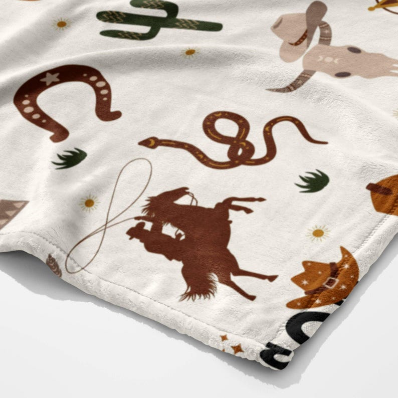 a white t - shirt with animals and letters on it