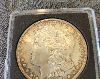1881 S Morgan Silver Dollar is  in BU condition and is from the San Francisco Mint. Inexpensive way to start collecting  silver dollars.