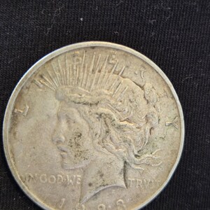 1923 D Peace Silver Dollar is Extra Fine conditioned and is from the Denver Mint. Inexpensive way to start collecting silver dollar. image 1