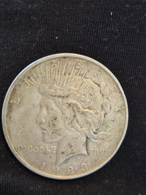 1923 D Peace Silver Dollar is Extra Fine conditioned and is from the Denver Mint. Inexpensive way to start collecting silver dollar.