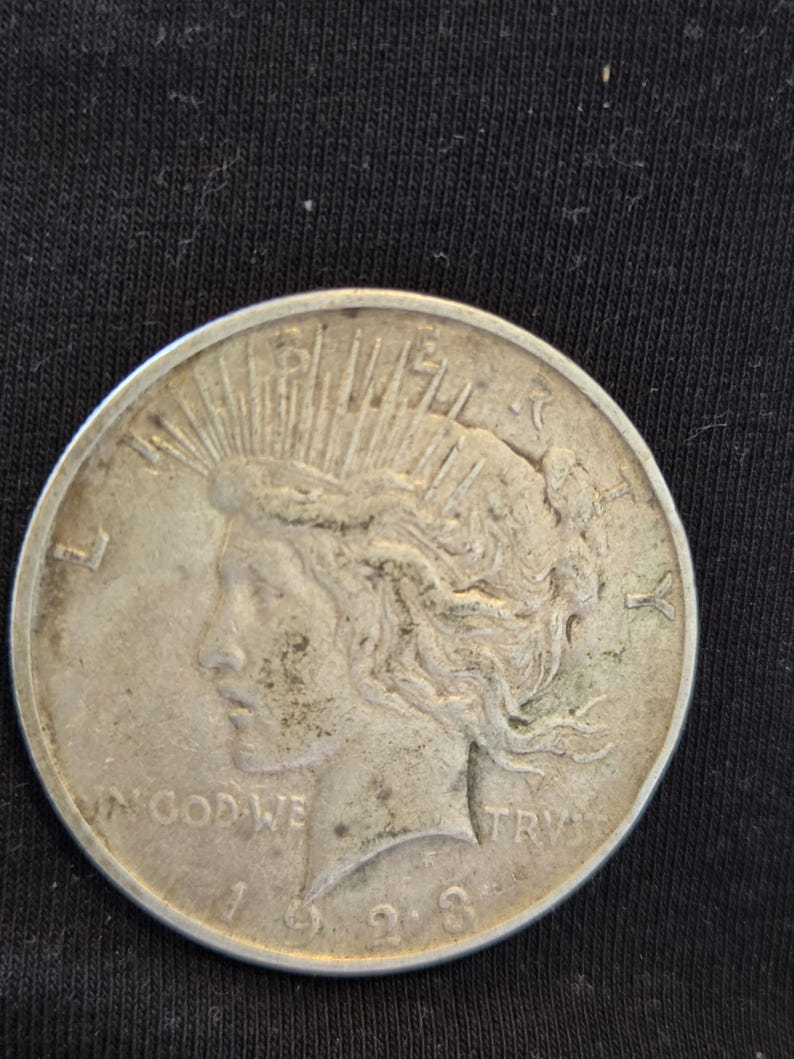 1923 D Peace Silver Dollar is Extra Fine conditioned and is from the Denver Mint. Inexpensive way to start collecting silver dollar. image 1