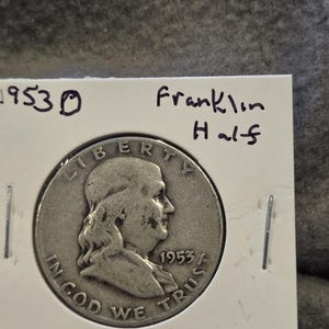 3 1950s era Franklin Half Dollars and a 1950s era dime and nickel.