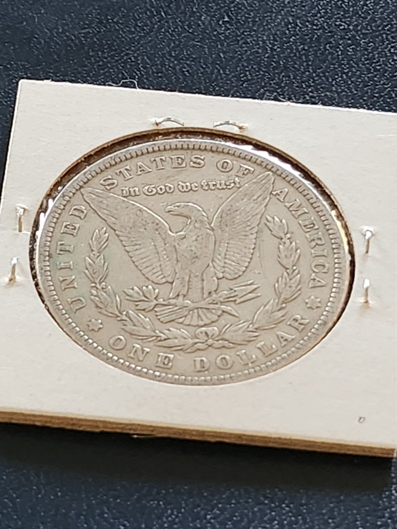 This 1881 O Morgan Silver Dollar is in AU condition and is from New Orleans. It is an inexpensive way to start collecting silver dollars. image 2