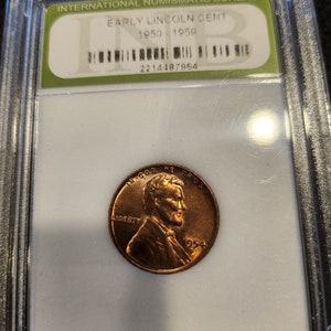 1954 D United States wheat Cent. Brilliant Uncirculated bright coin is in a plastic slab holder supplied by International Numismatic Bureau.