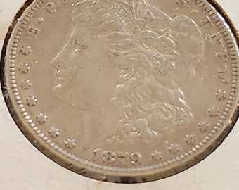 1879 P Morgan Silver Dollar is AU condition and is from the Philadelphia Mint. This is a inexpensive way to start collecting silver dollars.