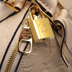 Louis Vuitton 18kt yellow gold padlock with 700 VVS diamonds for