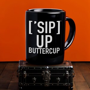 Cheery Sipper's Black Mug | ['SIP] Up, Buttercup | Uplifting Beverage Time | ['SIP·PERS]™ Collection
