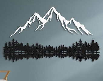 May include: White silhouette of a mountain range with a reflection of a forest below. The silhouette is mounted on a light blue wall with a wooden chair in the foreground.