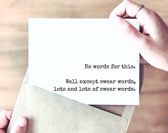 May include: A white rectangular greeting card featuring black typewriter-style text that reads: No words for this. Well except swear words, lots and lots of swear words. The card is partially inserted into a light brown paper envelope.