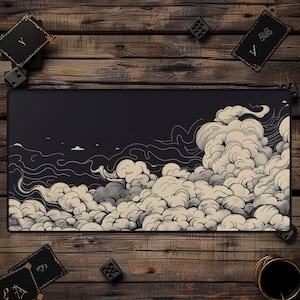 May include: A black and white illustration of clouds on a dark blue background. The illustration is printed on a black mouse pad.