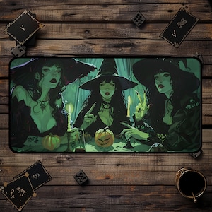 May include: Three witches wearing black hats and dresses are gathered around a table with a carved pumpkin and lit candles. The witches have long black hair and are holding various objects, including a glass bottle and a book.