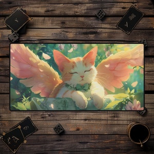 May include: A white and orange cat with pink wings is sleeping on a green leafy surface. The cat has its eyes closed and a green bow tie around its neck. The background is a soft green and pink with white flower petals.