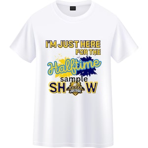 May include: White t-shirt with a blue and yellow graphic that says "I'm just here for the halftime show" with a logo that says "Human Jukebox".